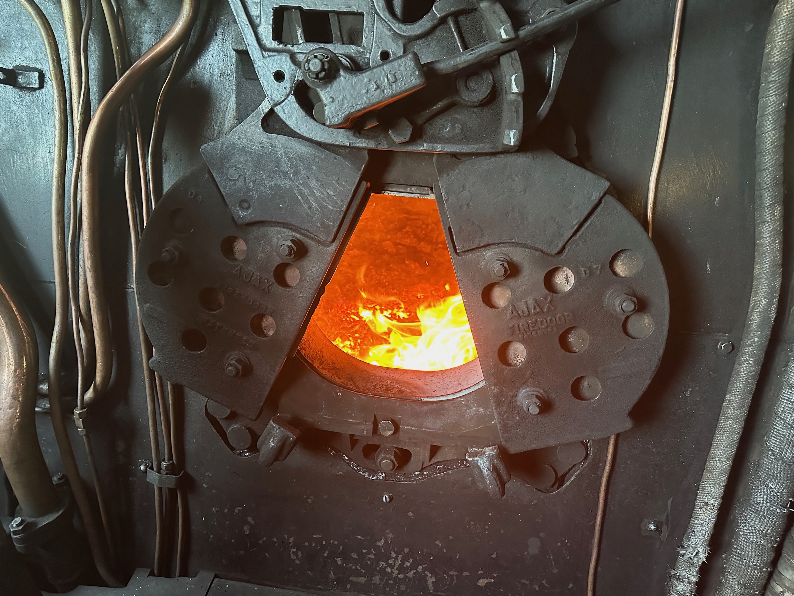 The firebox doors with the fire behind.